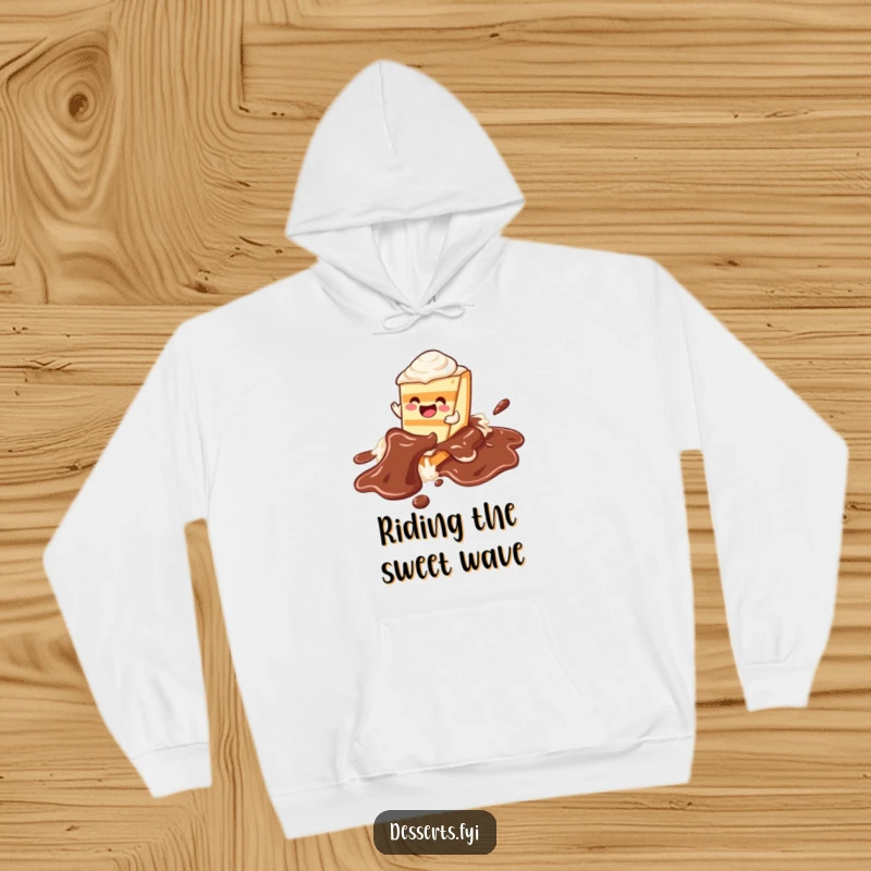 Funny cake hoodie featuring a happy character sliding down a chocolate syrup river, offering warmth and a dose of sweet humor.