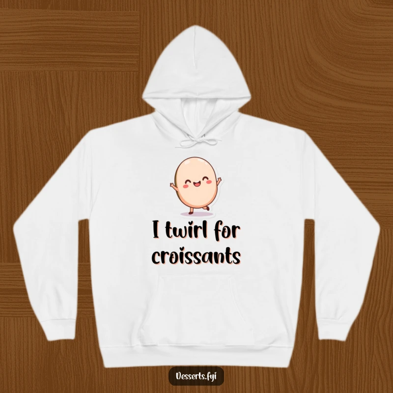 Funny Macaron Hoodie featuring a delighted macaron character doing a graceful twirl, offering warmth and sweet, whimsical humor.